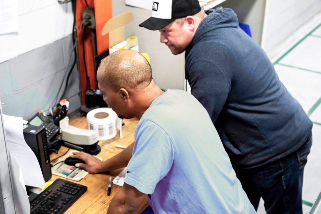 Myers Tire Supply Employees shipping product